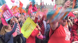 Thousands of striking teachers sing and dance during protest rally in London