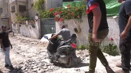 Palestinians inspect damaged after the Israeli army struck Jenin in the West Bank