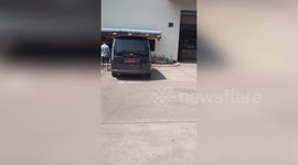 Van's rear windscreen glass suddenly falls off while parked outside warehouse