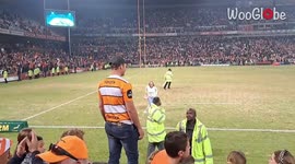 Enthusiastic Cheetahs fans sprint onto the field after their team wins 2023 Currie Cup