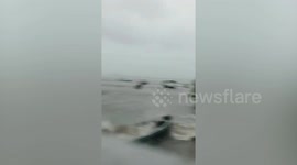 Rough waves batter boats amid storm in southern Thailand