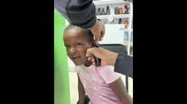 Girl's excitement about getting her ears pierced fades away on go-time