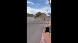 Biker flexes his awesomeness with gravity-defying wall ride & bottle-opening wizardry