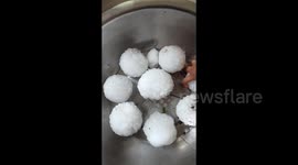 Egg-sized hailstones batter northern China, damaging vehicles
