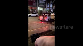 Furious driver knocks over man who physically blocks parking space in China
