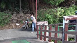 Dangerous wooden footbridge doubling as motorcycle ramp sparks concern among locals in Thailand