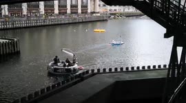 Blistering heat in London sends residents floating off Canary Wharf