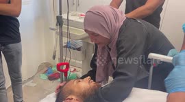 Relatives of Palestinian Abdul Jawad Saleh, who was shot killed by Israeli forces mourn over his body at a hospital, in the West Bank city of Ramallah