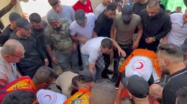 Palestinians carry the bodies of two men killed during an Israeli military raid in the old city of Nablus in the West Bank