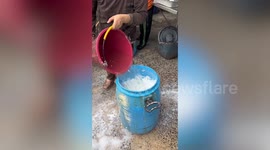 Watch Thai farmers process rubber tree sap into thin stretchy sheets