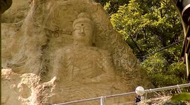 South Korea: Golgulsa Buddhist Temple. A sitting Buddha carved into the rock. Stone Buddha Temple. Gyeongju City. South Korea.