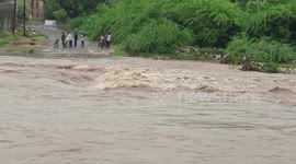 Risking lives, people cross under-construction bridge with work still incomplete in western India