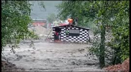 Officials use zip line to rescue residents from house threatened by raging floodwater in India