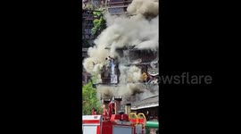 Tourists leap from guesthouse to escape flames in southwest China