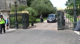 Vehicles leave Windsor Castle at the end of President Biden meeting with King Charles III
