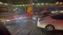Cars stuck on level crossing as train approaches in Bangkok