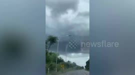 Terrifying tornado descends as storm brews in western Thailand