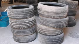 Palestinian youth Madian Helles, 27, recycles tyres in Gaza city