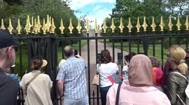 Visitors flock to the gates of Windsor Castle with cameras as President Biden flies in by helicopter