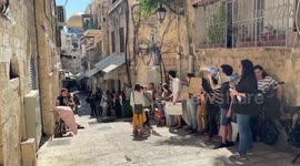 Activists gather near the residence of the Palestinian Sub Laban family following their eviction from their home in the Muslim Quarter in Jerusalem's Old City to make way for settler
