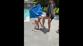 Baby gentleman tries to master the art of walking in someone else's shoes