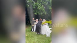 Twin sisters hold heartwarming double wedding to make milestone twice as nice
