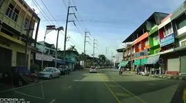 Motorist taking pupils to school crashes into oncoming motorcycle in Thailand