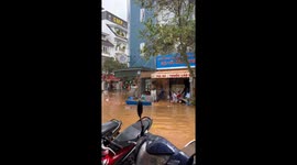 Man navigates flooded streets in Dalat City, Vietnam