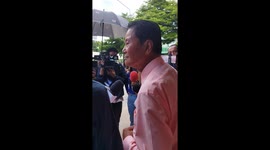 A person of influence is interviewed by many members of the media outside a local government building. Protesters and police prepare for the demonstration later today outside the Parliament in Bangkok, Thailand.