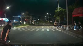 Chinese woman narrowly escapes from being hit by car after falling off motorcycle