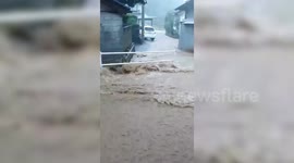 Torrential flood gushes through streets prompting evacuations in Japan