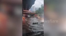 Traffic chaos as busy motorway is swamped with heavy floods in the Philippines