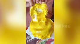 Thai woman tackles two of Burger King's new cheese only dishes