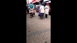 Full-of-life man on a mobility scooter sparks joy in busy market