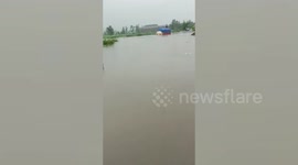 Truck with driver and helper rescued from flood after heavy rainfall in Powayan, Uttar Pradesh, India