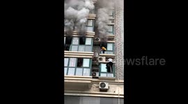 Heroic Chinese neighbour risks life to save child trapped in devastating house fire