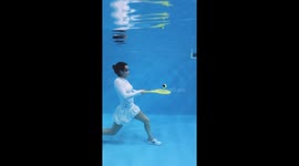 STUNNING images of past Team GB swimmer Rebecca Richardson swooshing some tennis shots underwater have been captured in a quirky homage to Wimbledon.