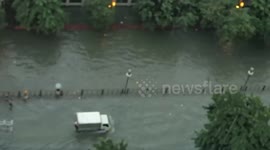 Thrill seeker rides JET SKI though flood in the Philippines