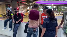 Brave protester risks prison with outfit mocking Thailand's 'crop top king'