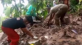 Cemeteries in Indonesia swept away by landslides, scattering human remains