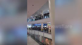 Rain pours through shopping mall ceiling during storm in the Philippines