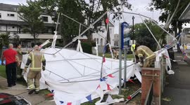 Marquee flips over in strong winds in east London