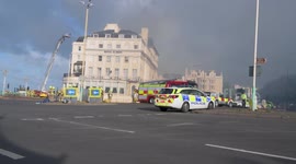 Fire continues at Albion Hotel, as strong winds fan blaze, Brighton, East Sussex, UK