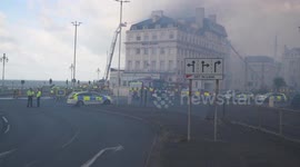 Firefighters from as far as London, try to bring huge blaze at Hoel under control, Brighton, East Sussex, UK