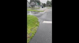 Flooding so bad that storm drains gushing with water.