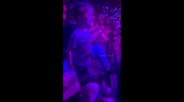 Boy with nonverbal autism playfully interacts with acrobat and warns him to be safe