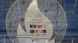 Paris Olympic Games 2024: A giant clock under Eiffel Tower displays the countdown before the D-Day.  Rehearsal: test with fifties boats on the Seine River, Paris, France. 17 july 2023. Training with the police special forces, river Brigade and organizers.