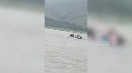 Eight teachers stranded on swollen river rescued in the Philippines