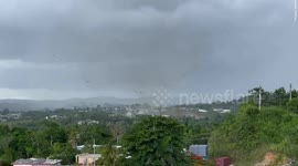 Tornado in Puerto Rico sends debris hundreds of feet into the air