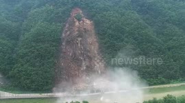 Landslide engulfs mountain road as heavy rain pummels South Korea